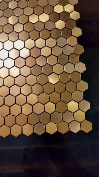 A close-up of metallic-look hexagons, showing the tonal variation as the viewing angle changes.